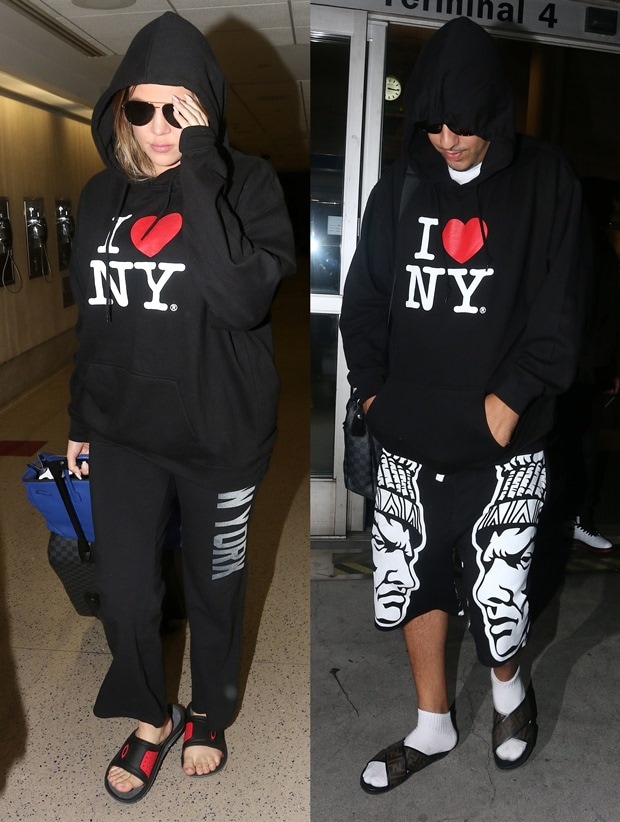 Khloé Kardashian and French Montana sport matching 'I ♥ NY' hoodies at LAX, with Khloe opting for Oakley flip-flops and casual black track pants