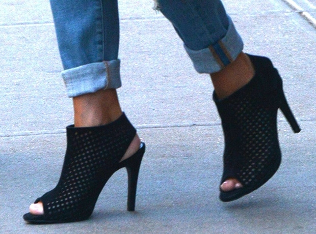 Lea Michele effortlessly cuffs her jeans to the perfect ankle length, highlighting her Pedro Garcia peep-toe booties for a chic, elongated silhouette