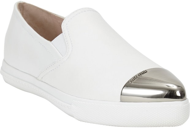 Crafted with smooth leather and a signature metal cap-toe, these Miu Miu slip-on sneakers effortlessly combine casual comfort with high-fashion glamour