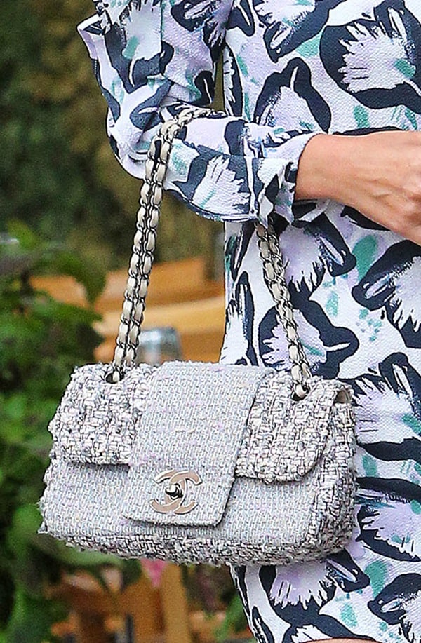 Nicky Hilton pairs her abstract floral-print mini dress with a textured Chanel tweed Flap Bag featuring the iconic CC turn-lock and silver chain strap