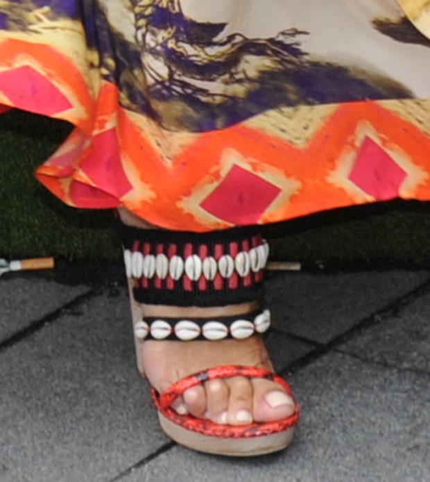 A closer look reveals the designer’s eclectic craftsmanship—embroidered straps, shell accents, and sculpted wooden platforms that embody bohemian luxury