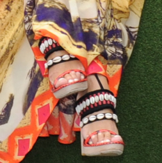 Nicole Scherzinger steps out in striking Dries Van Noten sandals detailed with red snake-stamped leather and rows of gleaming cowrie shells