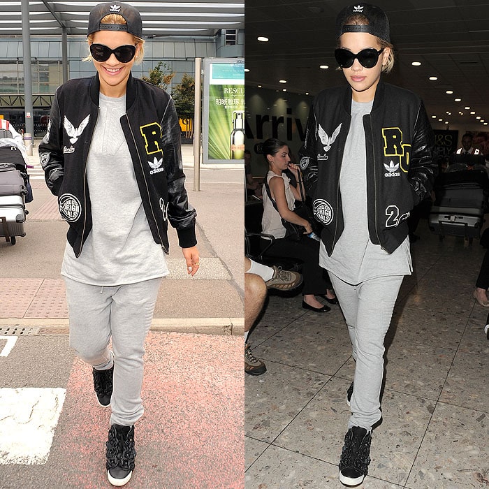 Rita Ora rocks a casual yet trendy airport look with a sporty jacket, gray sweatsuit, and Chanel 'Camellias' high-top sneakers