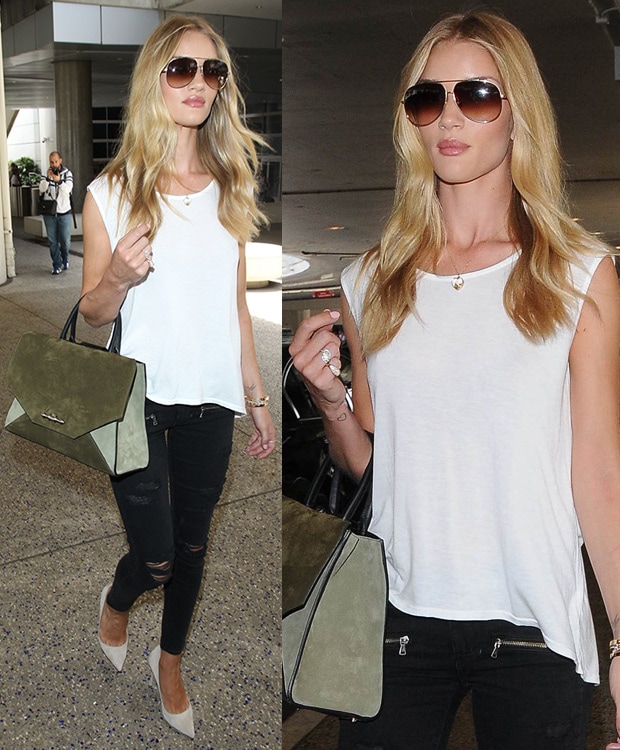 Rosie Huntington-Whiteley effortlessly nails airport chic in a white sleeveless top, distressed black skinny jeans, white Manolo Blahnik 'BB' pumps, and an oversized suede handbag