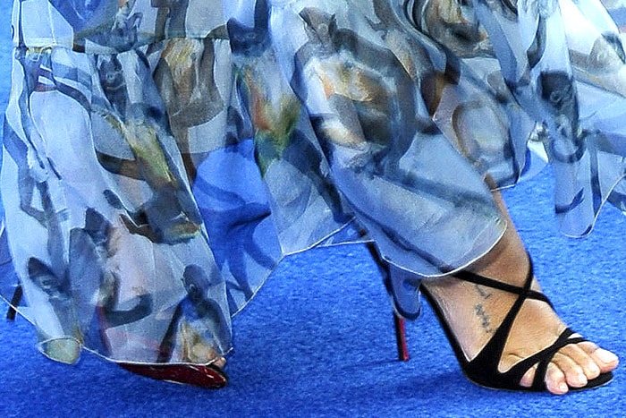 Zoe Saldaña elevated her ethereal Valentino gown with Christian Louboutin 'Audrey' sandals in black suede, adding a sleek, sophisticated contrast to her flowing, romantic look