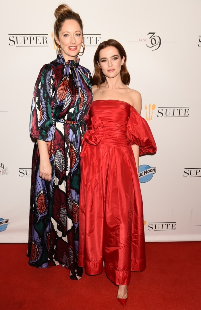 Zoey Deutch and Judy Greer attend the Buffaloed premiere during the 2019 Tribeca Film Festival at Regal Cinema Battery Park in New York City on April 27, 2019, with Deutch finishing her strapless red gown in matching pointed-toe pumps while Greer opts for a patterned maxi dress that keeps the focus on silhouette over statement footwear