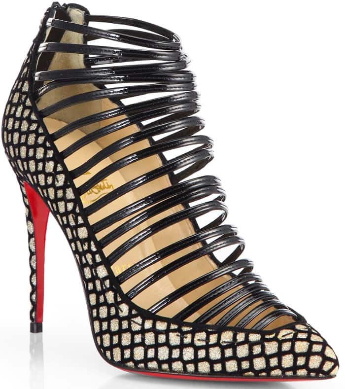 From every angle, the "Gortik" booties offer a striking profile, blending the edge of a caged sandal with the sophistication of a pointed-toe bootie