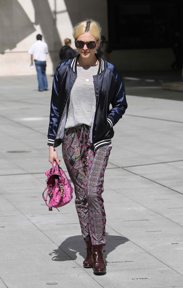 Fearne Cotton pairs a satin bomber with printed drawstring pants, grounding the look with sturdy ankle boots that add a practical, street-ready finish
