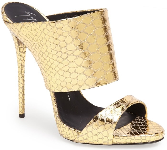 A snake-textured goldtone finish heightens the unmistakable glamour of a scene-stealing sandal set on a slim stiletto heel