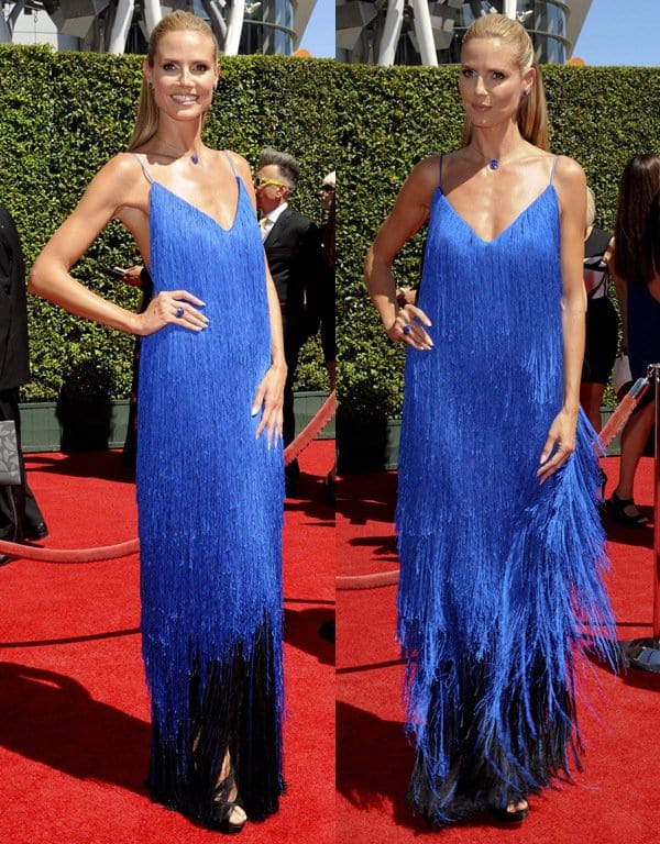 Heidi Klum strikes a poised front-facing stance in Sean Kelly’s cobalt fringe gown, the barely visible black Jimmy Choo platform sandals quietly anchoring the dramatic, floor-grazing silhouette at the 2014 Creative Arts Emmy Awards