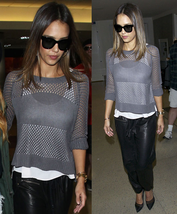 Jessica Alba elevates her airport look with black Diane von Furstenberg Bianca pumps, pairing the sharp heels with a gray mesh sweater, leather track pants, and oversized sunglasses for effortless jet-set polish