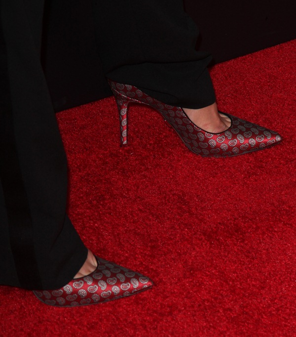 Katie Holmes steps out in red paisley-print Michael Kors “Avra” pumps, the sharp pointed toes and slim stiletto heels adding a bold pop of pattern against the crimson carpet