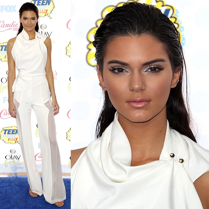 Kendall Jenner turned heads at the 2014 Teen Choice Awards in a sleek, all-white Oriett Domenech ensemble, featuring sheer leg panels and paired with Stuart Weitzman 'Nudist' sandals for a bold and modern look