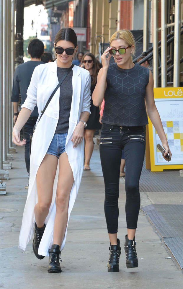 Kendall Jenner wears a white Stone Cold Fox Boston gown as a coat while joined by Hailey Baldwin