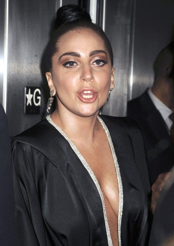 Lady Gaga showcases the plunging neckline and crystal-trimmed detailing of her custom black Alon Livné caftan gown