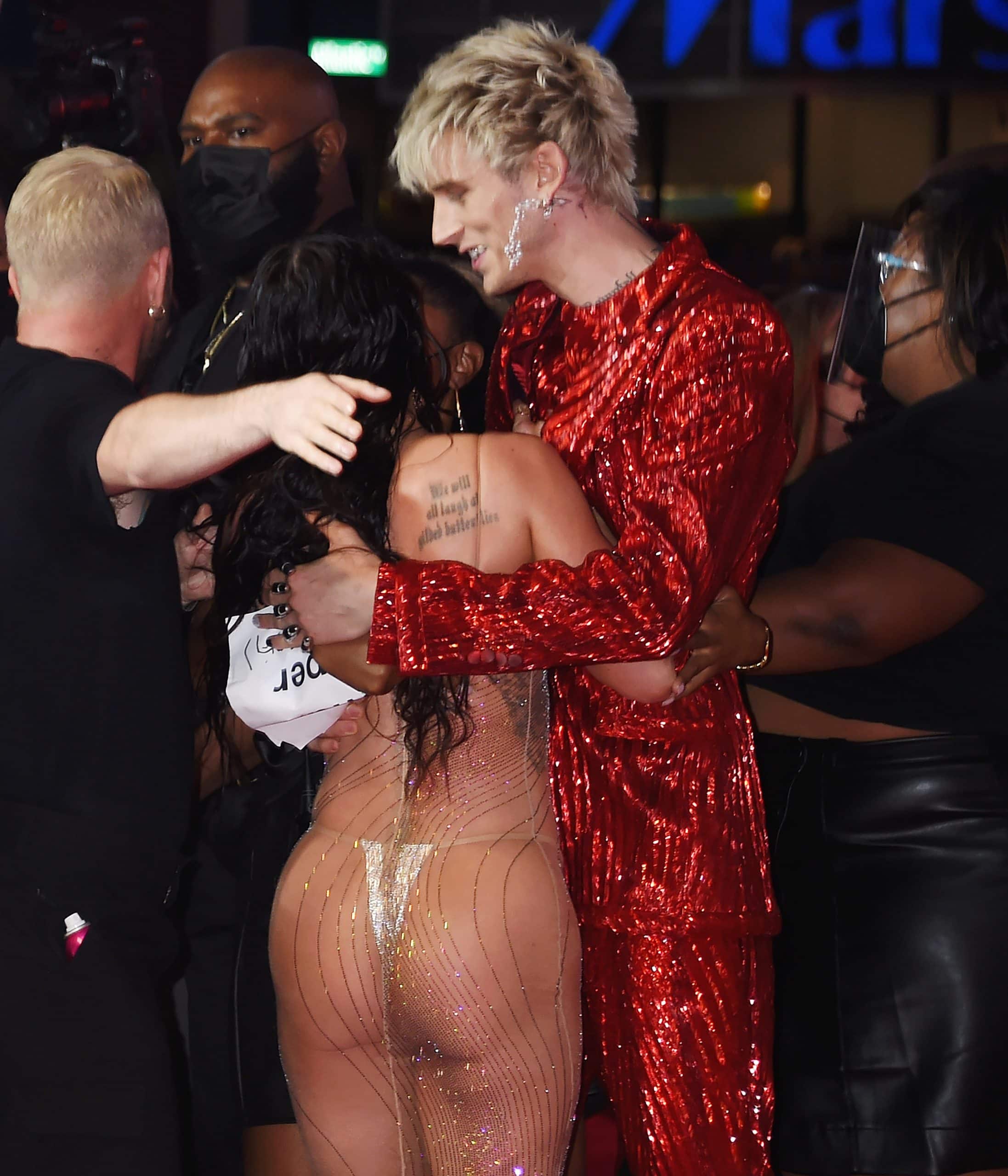 Megan Fox in a custom Mugler dress and her boyfriend MGK in a Dolce Gabbana Alta Sartoria outfit