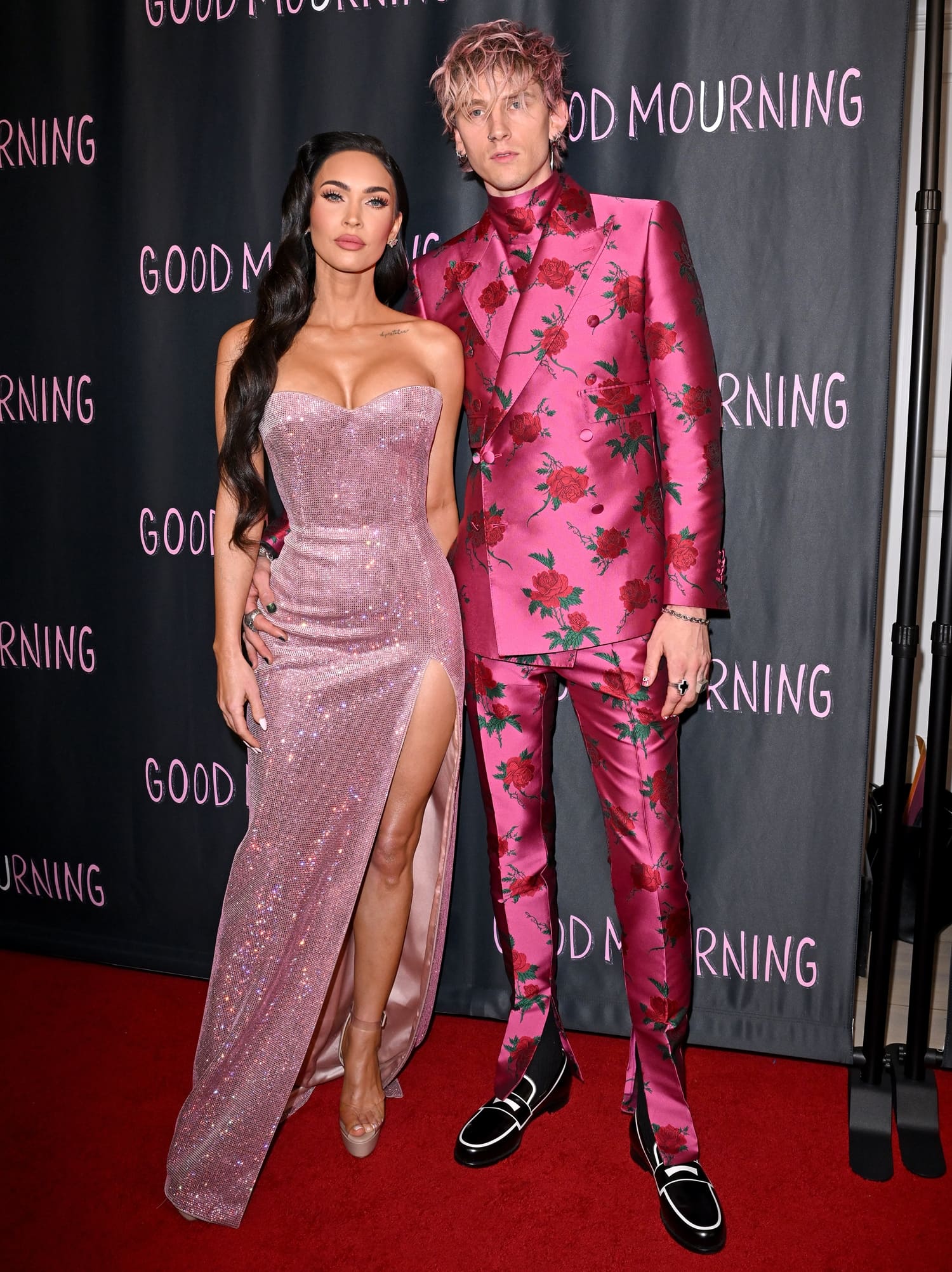Megan Fox in a strapless pink Philosophy di Lorenzo Serafini dress and Machine Gun Kelly in a pink Dolce Gabbana suit at the premiere of their new film Good Mourning