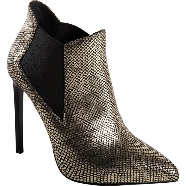 The Saint Laurent “Paris” ankle boots feature snakeskin-stamped leather, elastic side panels, and a slender square heel for a refined statement finish