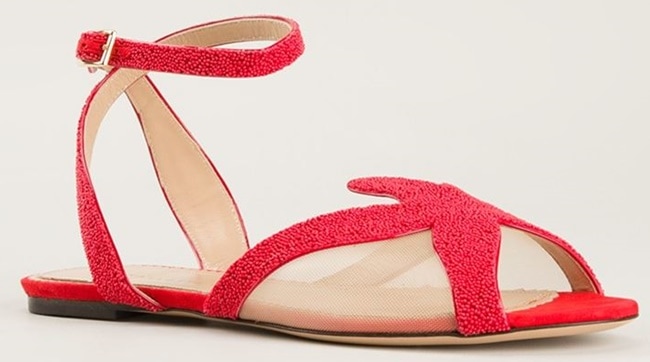 Charlotte Olympia “Sandy” starfish sandals showcase hand-beaded red detailing shaped into a playful starfish motif, set against sheer mesh panels and finished with a flat sole for comfort without sacrificing statement appeal