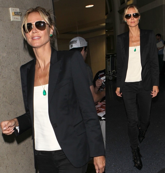 Heidi Klum opted for a monochromatic ensemble consisting of black skinny jeans worn with a white shirt and a black blazer