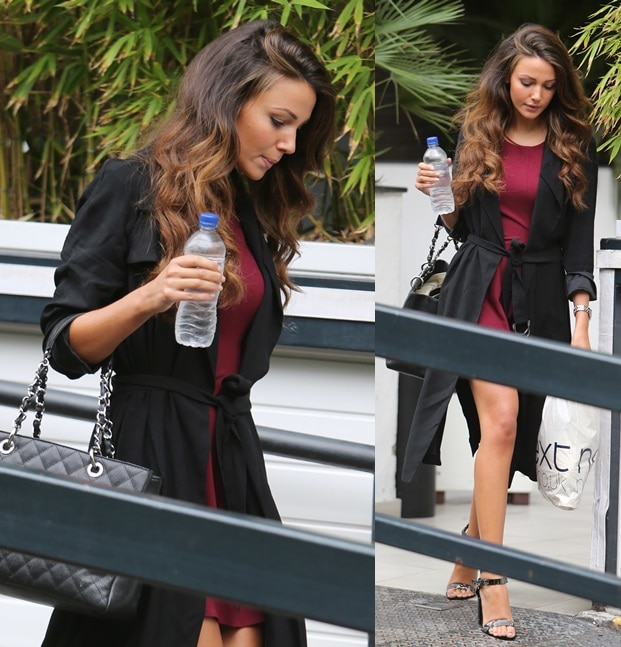 Michelle Keegan looks chic in a short maroon dress paired with ankle-strap heels and a long black trench coat as she leaves ITV Studios in London