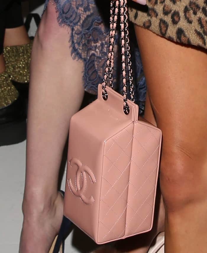 Chanel’s whimsical Milk Carton bag features signature quilted leather, the iconic interlocking CC logo, and a chain strap—blending playful design with luxury craftsmanship