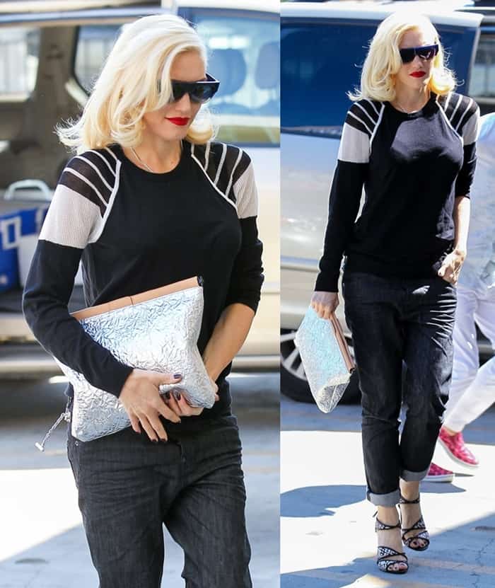 Gwen Stefani styles a sporty black-and-white L.A.M.B. top with cuffed jeans, strappy L.A.M.B. Warren heels, and a statement foil-textured clutch for a bold yet casual daytime look