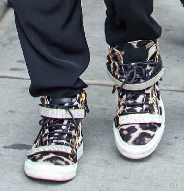 These Giuseppe Zanotti high-top trainers feature a striking leopard-print ponyskin finish accented by crystal-encrusted Velcro straps and gold-tone zippers