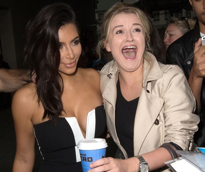 Kim Kardashian poses with an excited fan outside BBC Radio 1 studios in London