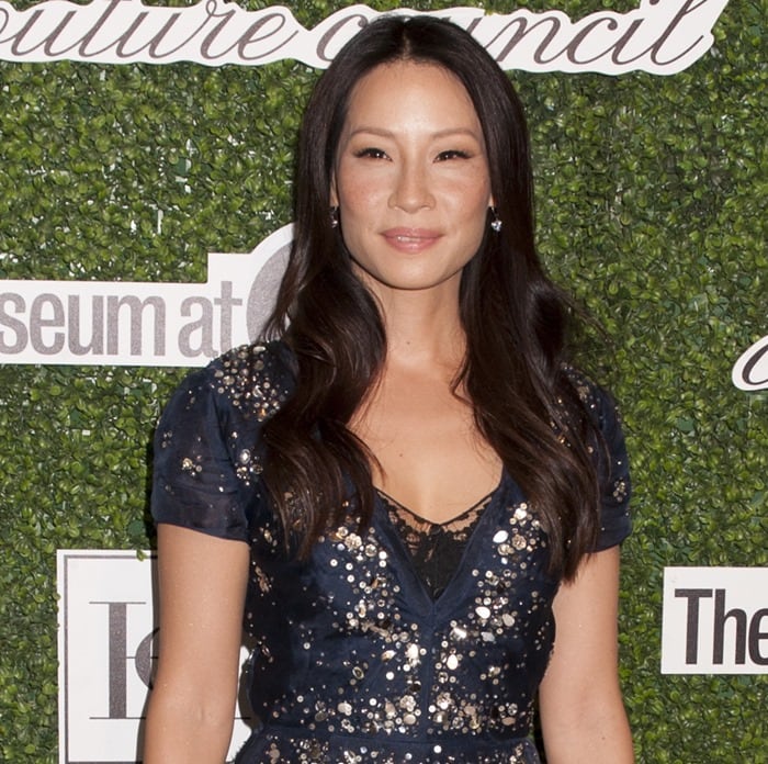 Lucy Liu dazzles in a sparkling navy blue Carolina Herrera dress at the 2014 Couture Council Awards Annual Benefit Luncheon in New York City