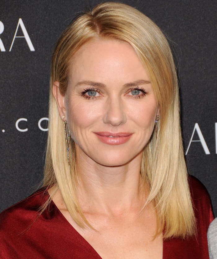 Naomi Watts wears Jennifer Fisher jewelry with her red Altuzarra for Target wrap dress