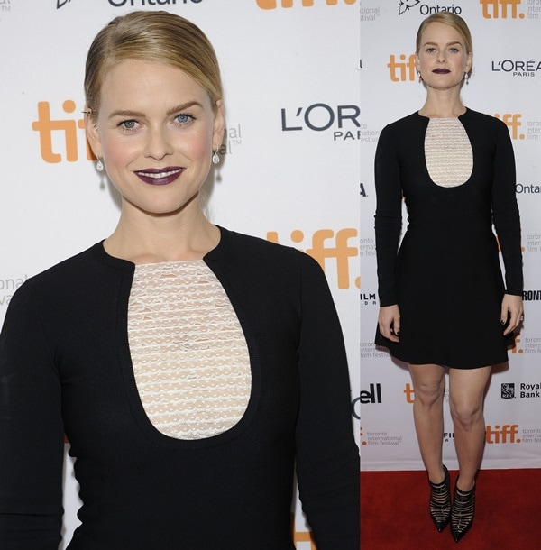 Alice Eve with purple lips and a sleek ponytail