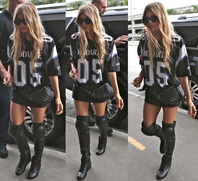 Fergie in a skimpy outfit paired with thigh-high sneakers and a quilted fanny pack