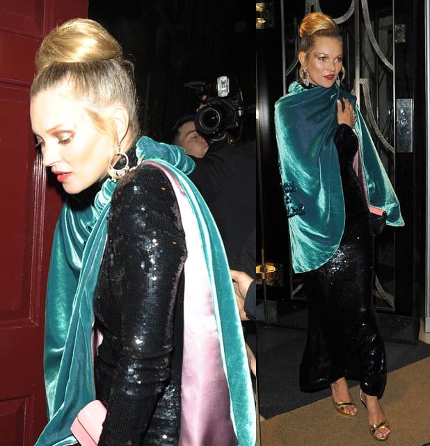 Kate Moss stuns in a 70s-inspired ensemble featuring a shimmering sequined dress, metallic gold sandals, and a luxurious seafoam velvet cape