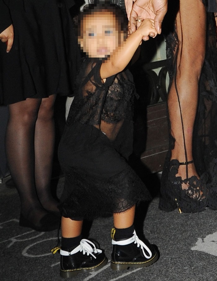 Kim Kardashian’s daughter, North West, matched her mom in an all-black lace outfit with mini Dr. Martens boots, turning heads at Paris Fashion Week