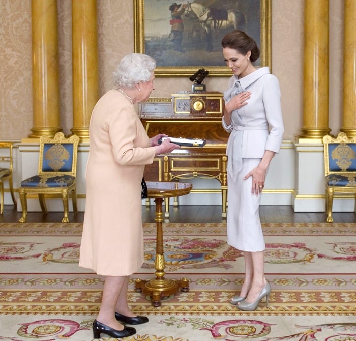 For her meeting with the Queen, Angelina sported a gray wool crepe peplum jacket paired with a pencil skirt from the Ralph Russo Spring 2014 Couture collection