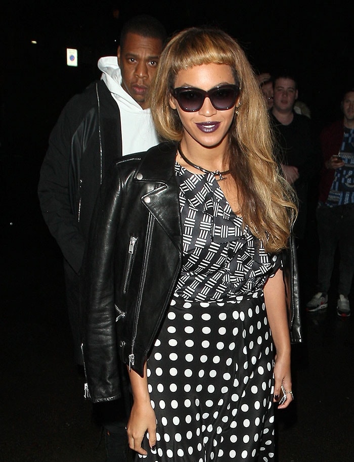 Beyoncé stepped out alongside Jay-Z in a leather jacket layered over a graphic top and polka-dot bottoms
