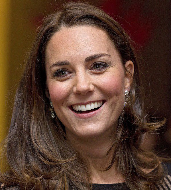 Catherine, Duchess of Cambridge, shows off her diamond earrings and a dazzling smile