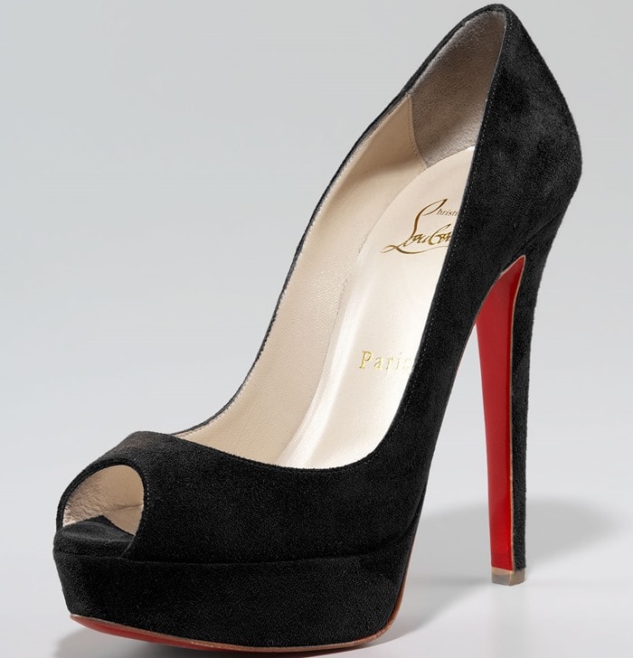 In timeless black suede, the “Banana” pump becomes a versatile statement heel, balancing its dramatic platform with a clean, elegant finish