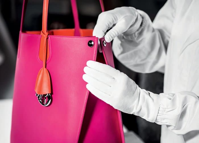 Gloves are worn during the final inspection to ensure every Dior bag remains pristine, flawless, and free from even the slightest imperfection