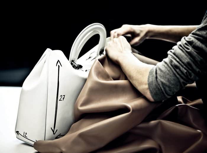 Christian Dior preserves traditional craftsmanship in Southern Italy, where artisans meticulously shape and measure each bag by hand for flawless precision