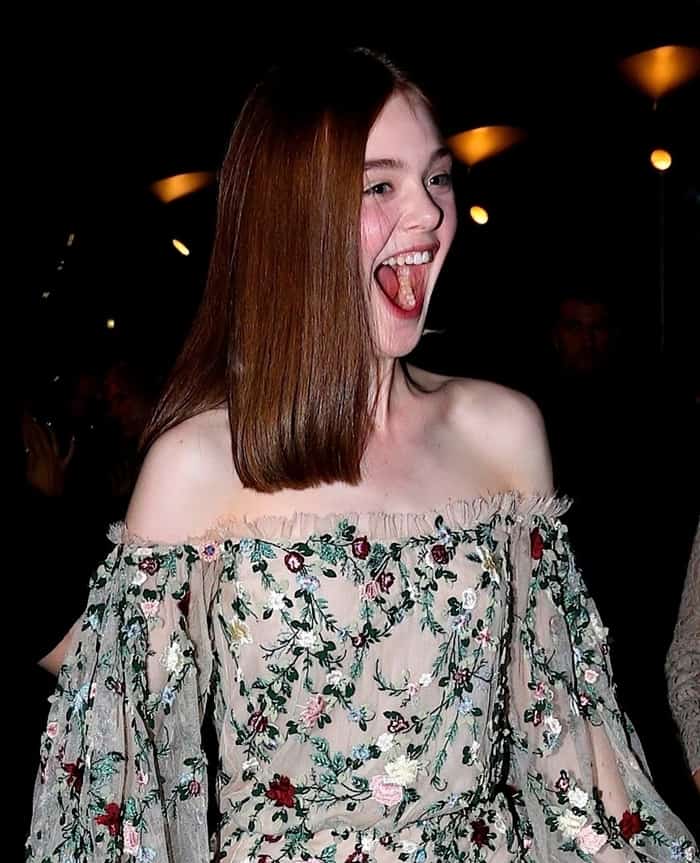 Elle Fanning beams in a stunning off-shoulder floral Marchesa dress at the Los Angeles premiere of 'Low Down'