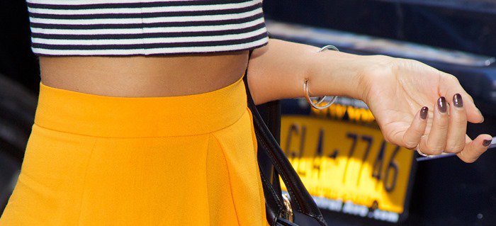 Jessica Alba's bold tangerine skirt perfectly complements her striped crop top
