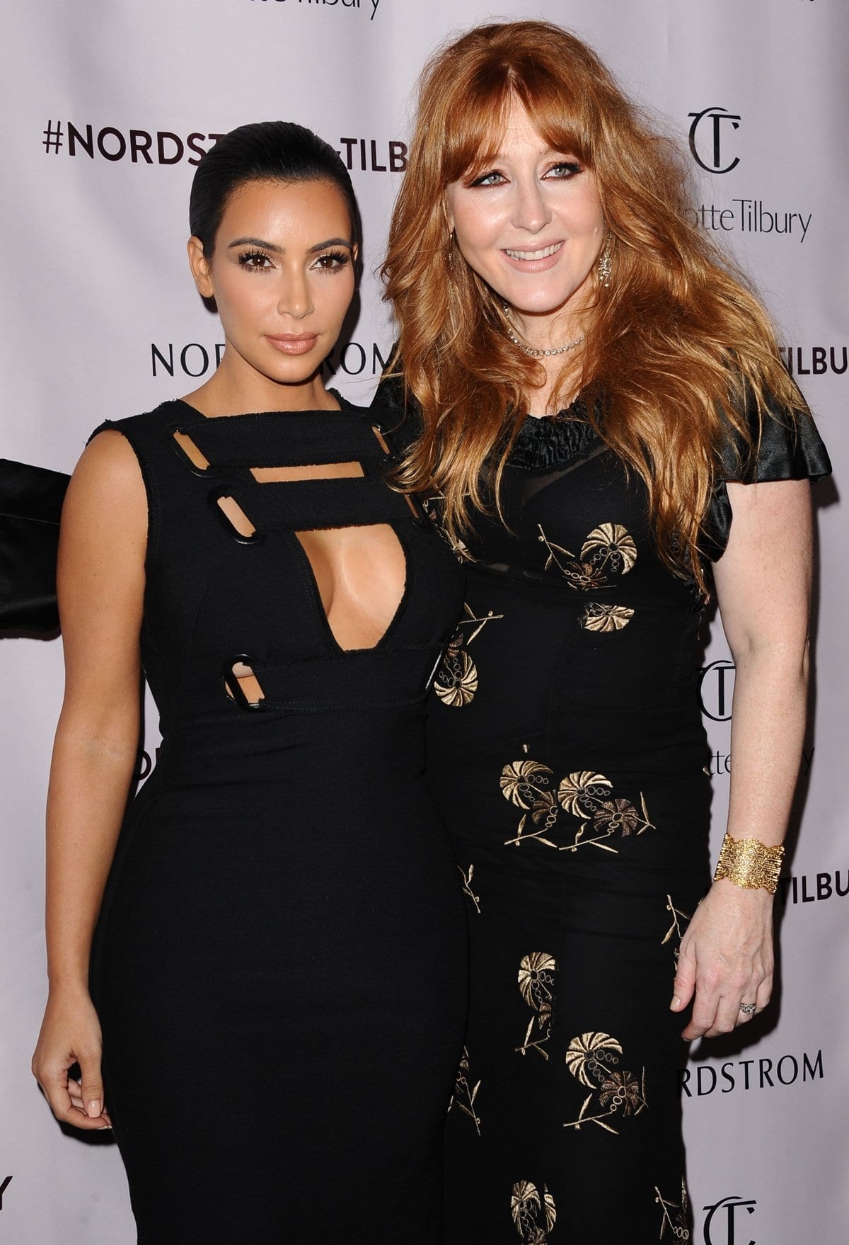 Kim Kardashian celebrates with makeup artist Charlotte Tilbury at the VIP beauty launch event, showcasing the glamorous results of Tilbury's artistry
