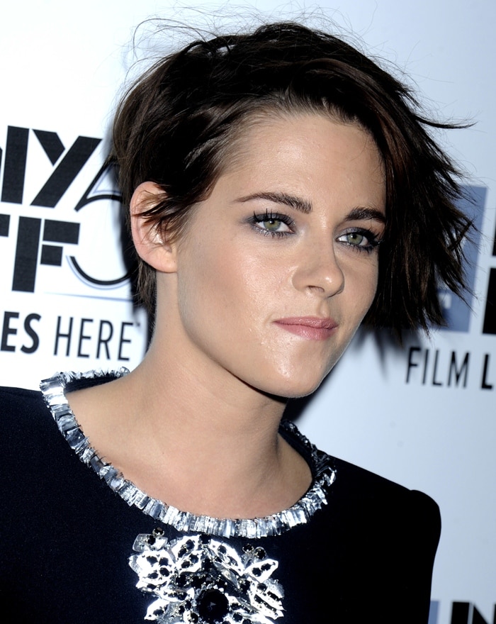Kristen Stewart's edgy dress features monochromatic floral embroideries and aluminum details on the neckline