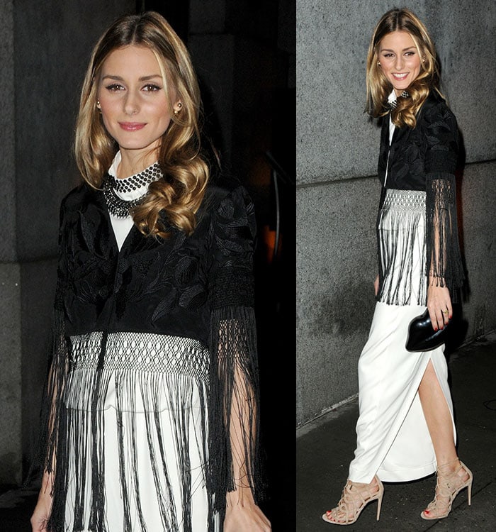 Olivia Palermo in a long cream satin dress and a black embroidered kimono with tassel details