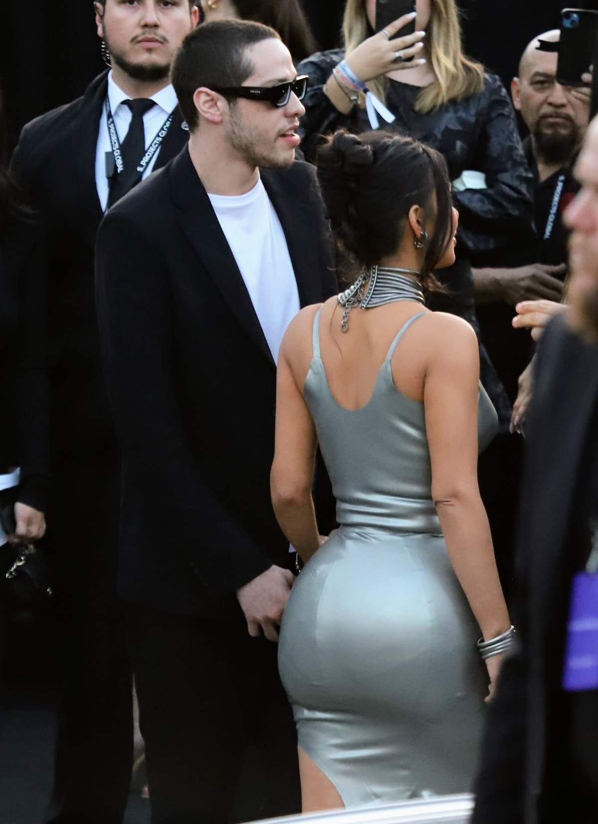 Pete Davidson and Kim Kardashian arrive at the Los Angeles premiere of Hulu's new show "The Kardashians", with Kim wearing a sleek, metallic dress and a large choker necklace