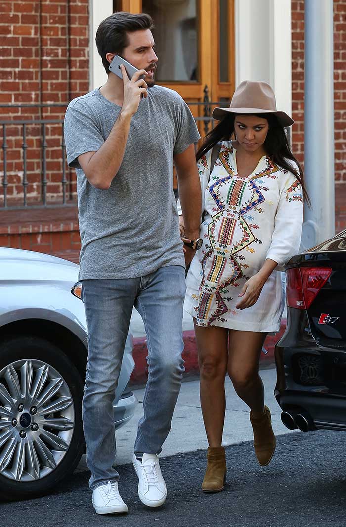 Pregnant reality star Kourtney Kardashian wearing a smock dress by Kate Moss for Topshop
