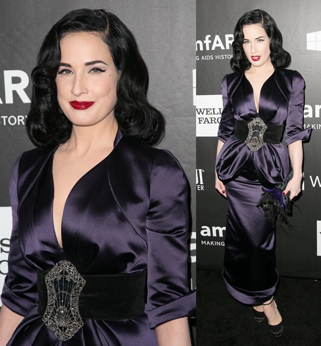 Dita Von Teese attends the 2014 amfAR Gala in Beverly Hills wearing a deep purple satin gown cinched with an ornate jeweled belt, embodying classic old-Hollywood glamour