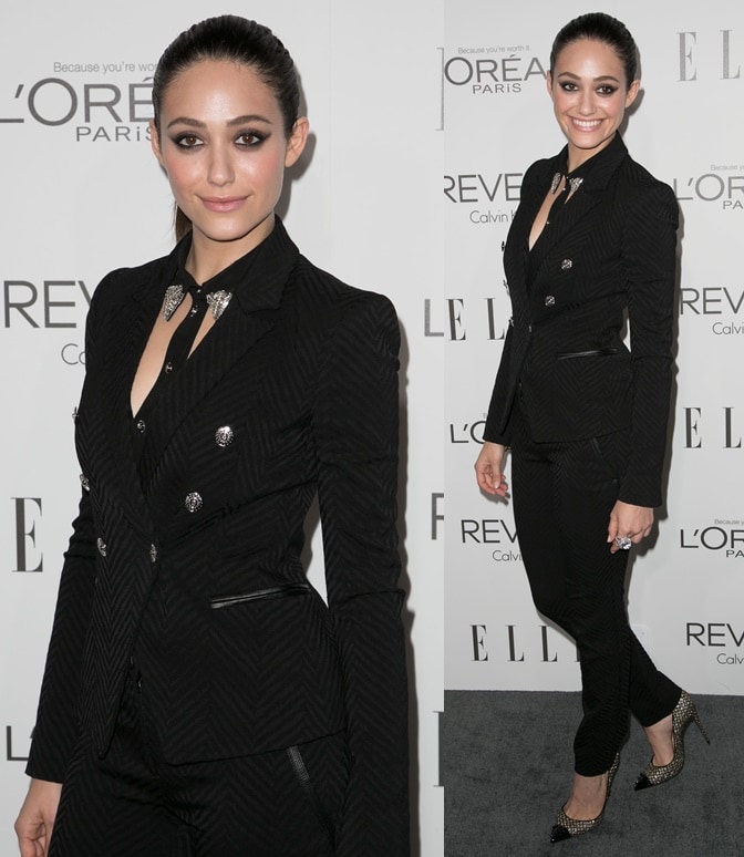 Channeling "lady boss" style, Emmy Rossum looks sharp in a tailored Versace pantsuit. Her choice of footwear—glittery Christian Louboutin "Geo" pumps—adds the perfect touch of sparkle to her all-black ensemble